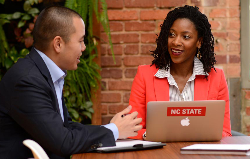 Man & woman at conference table